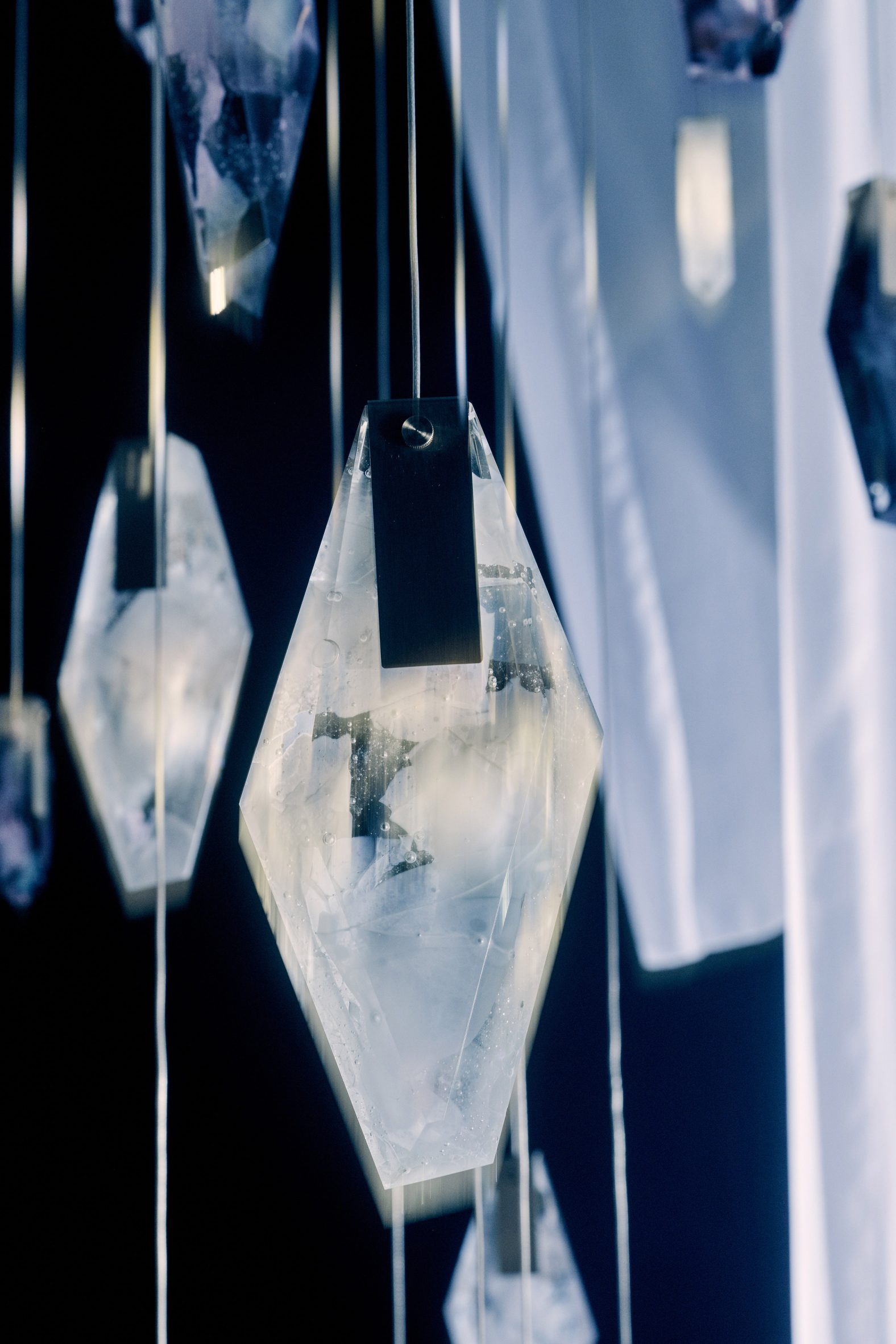 Close-up view of a faceted crystal lighting piece created from recycled glass