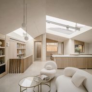Sunken lightwells illuminate partially submerged London home by Stylus Architects