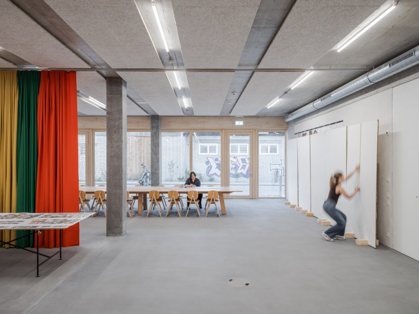 Grey office with red drapes