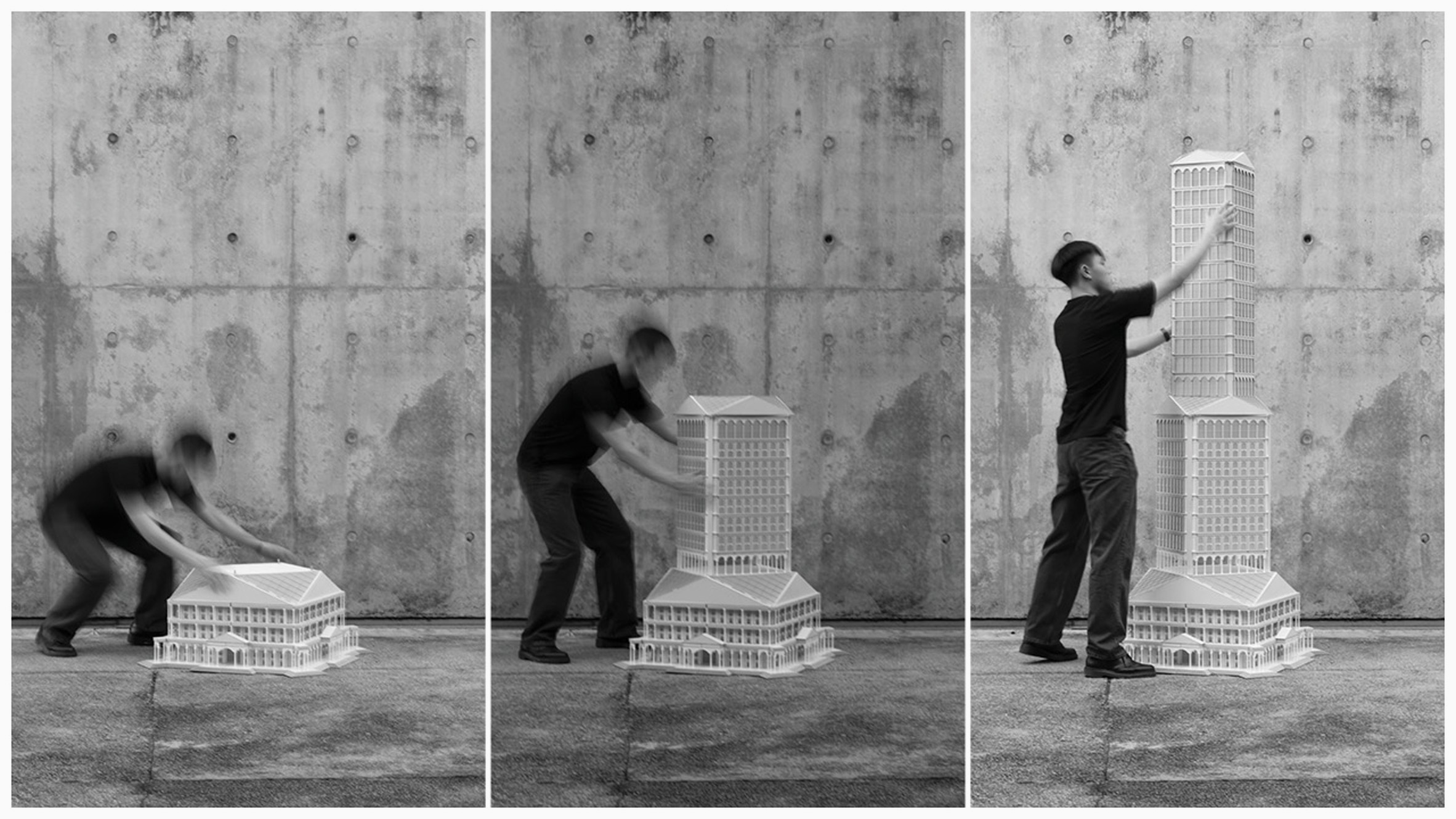 Person building a tall architectural model