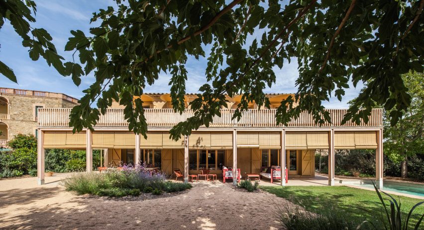 Garden elevation showing the extension's porch, terrace and outdoor living spaces