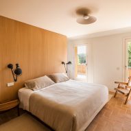 Master bedroom with timber joinery and access to an outdoor terrace