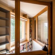 View through internal glazing overlooking the double-height library space