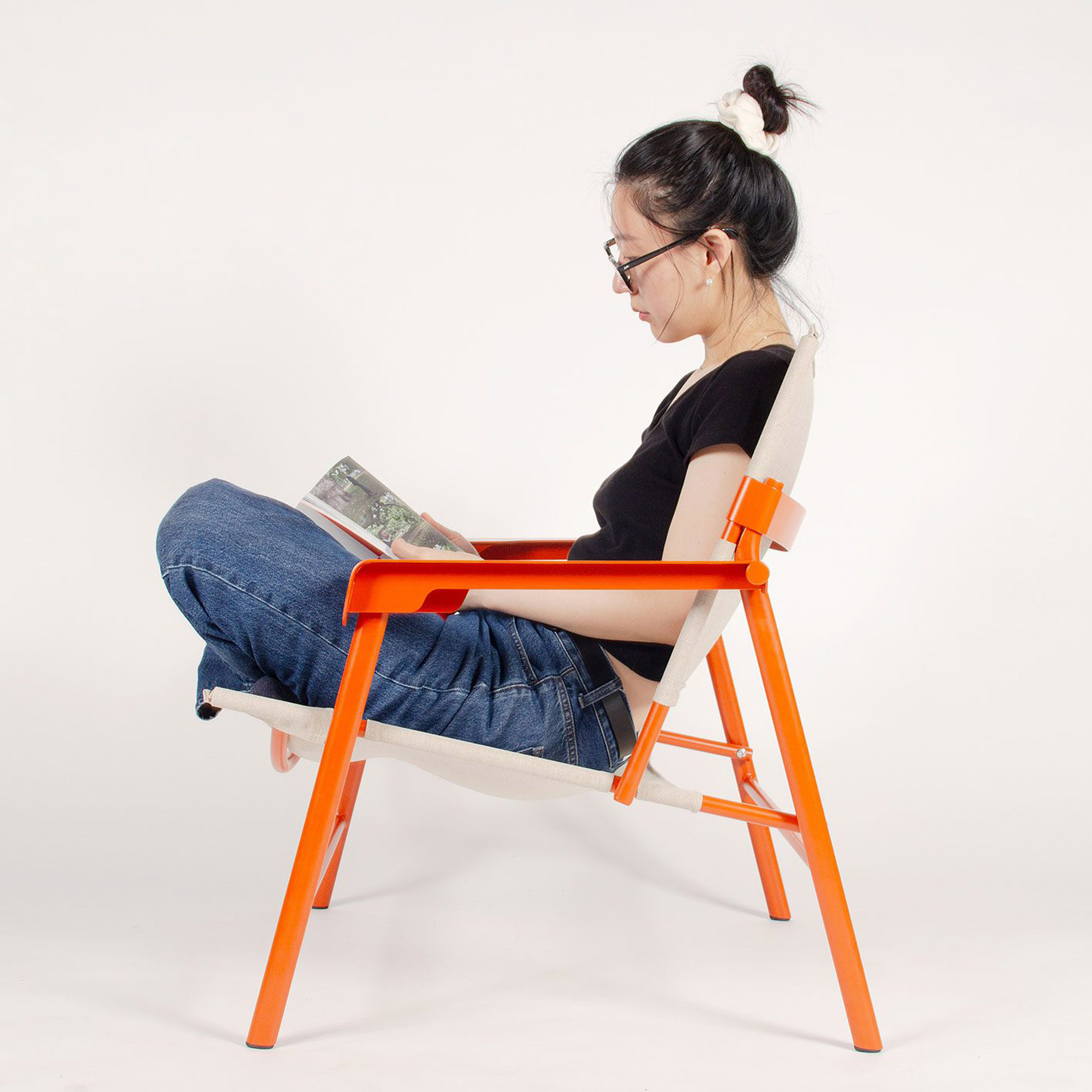 image of a person sitting in a orange and beige chair