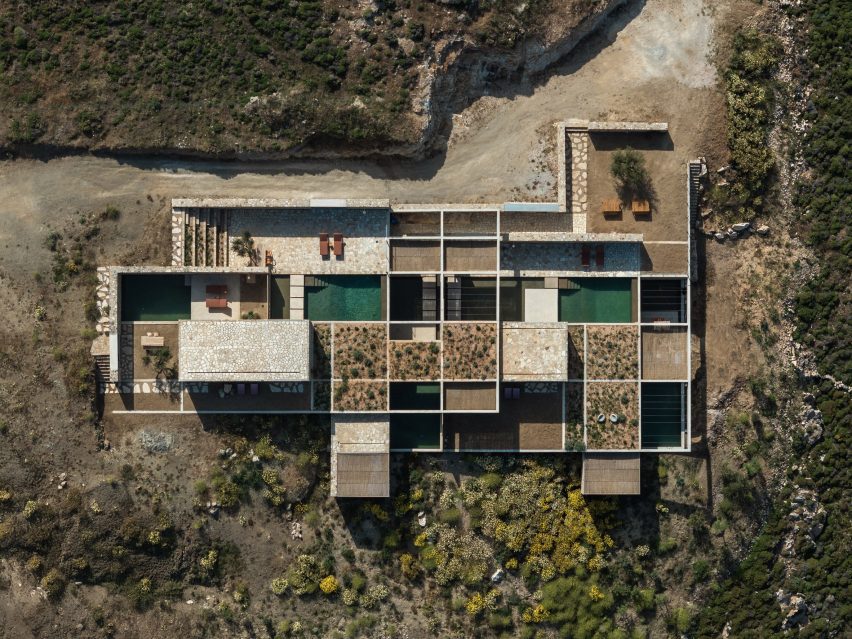 Aerial view showing pools, planted roofs and courtyards arranged within a concrete grid