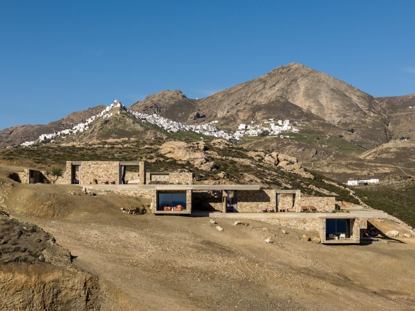 Stone accommodation units stepping down a sloping site on Serifos