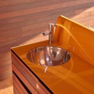 Orange painted kitchenette in PC3 by Casey Brown Architecture