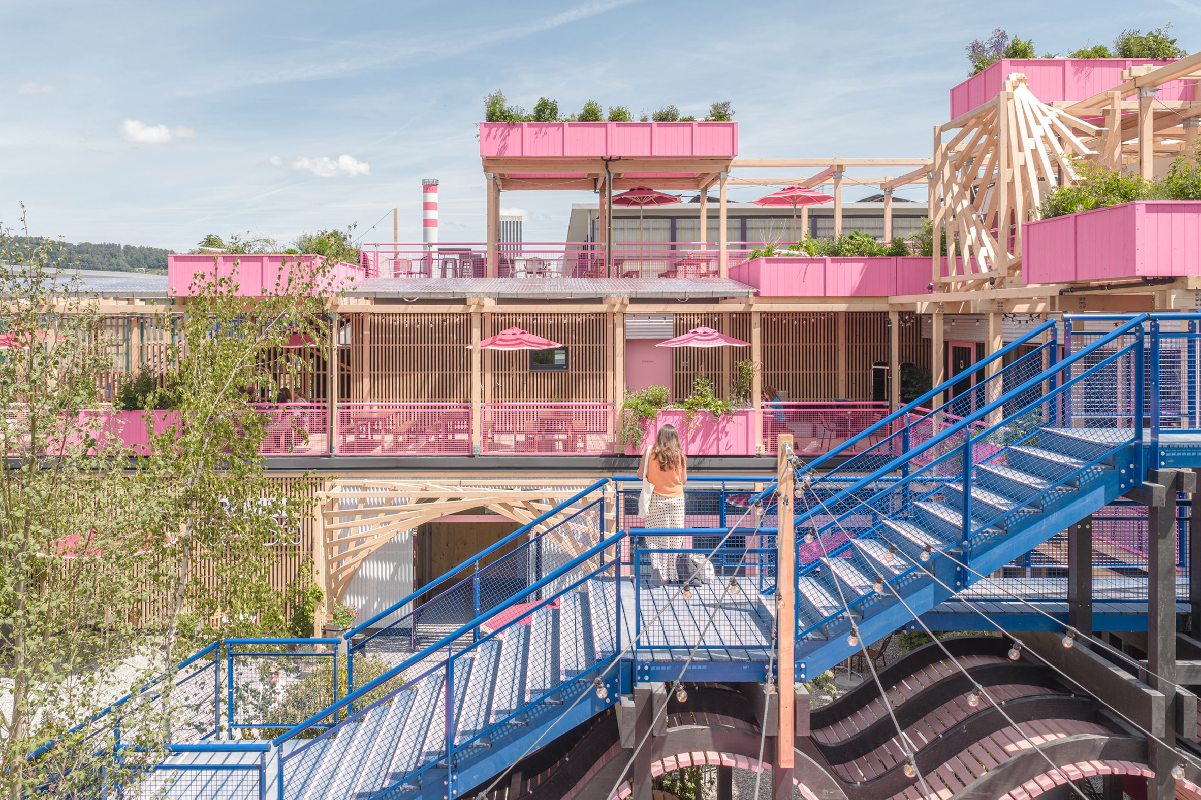 https://static.dezeen.com/uploads/2026/06/remise-rosa-studio-wood-complex-zurich_dezeen_2364_col_1.jpg