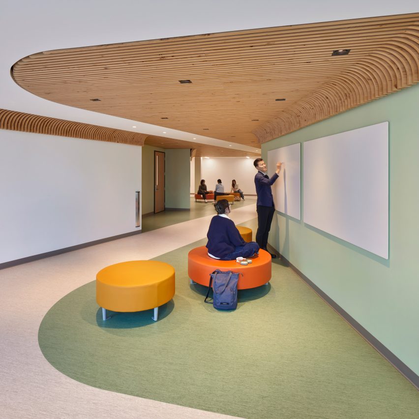 Wood ceiling elements continue through informal learning areas