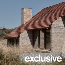 Unknown Architects sinks timber cabin into dune-filled Dutch island