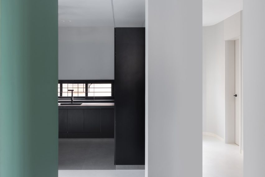 The monotone kitchen contrasts the rest of house in Villa Corsica by Neel Buddhadev