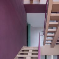 Bordeaus stairs lead to the upper levels in Villa Corsica
