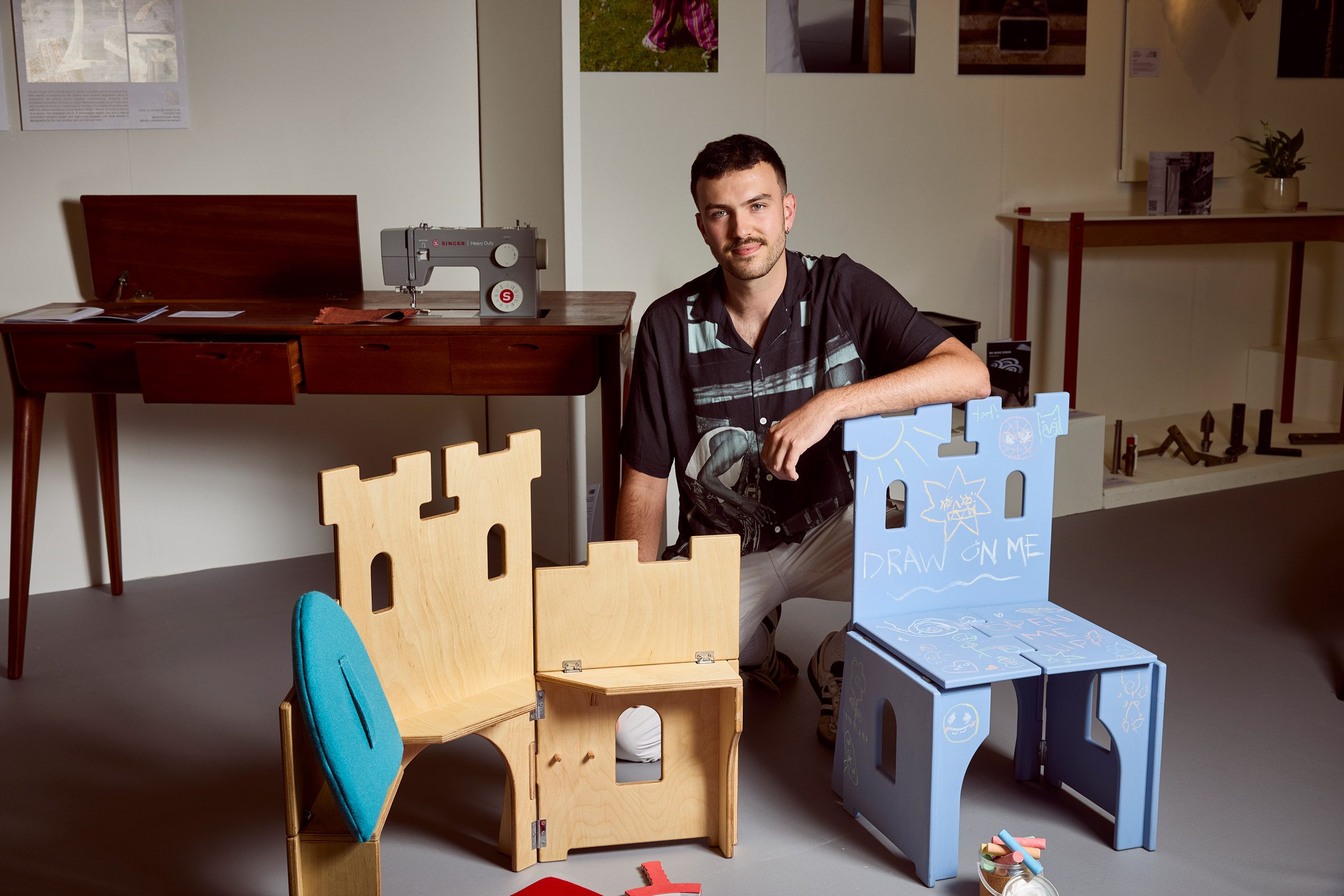 Photo of designer with chairs