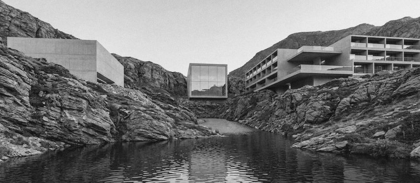Grey image of buildings situated next to water