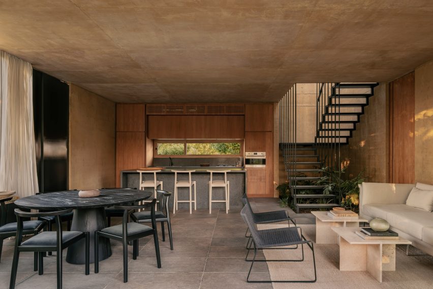 Interior of Argentina house with plants under the stairwell