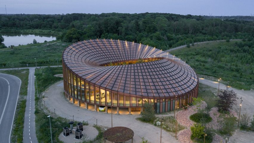 BIG arranges circular Dymak HQ around stepped courtyard