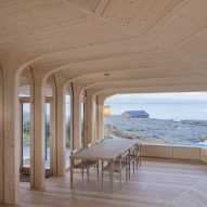 Helen & Hard uses uprooted spruce trees to shape Norwegian cabin