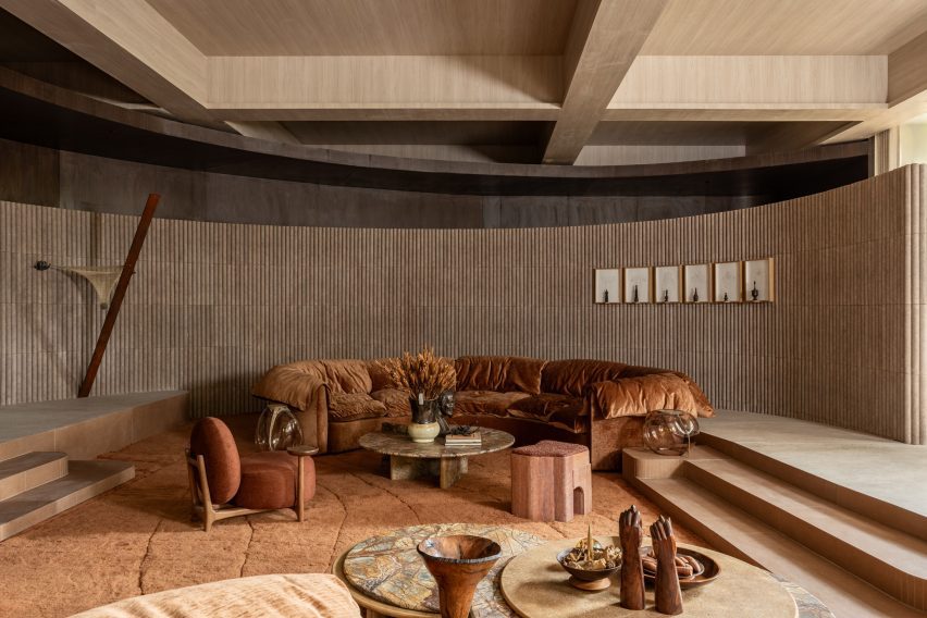 Showroom with warm tones and curved shapes that's intended to feel "like a cocoon"