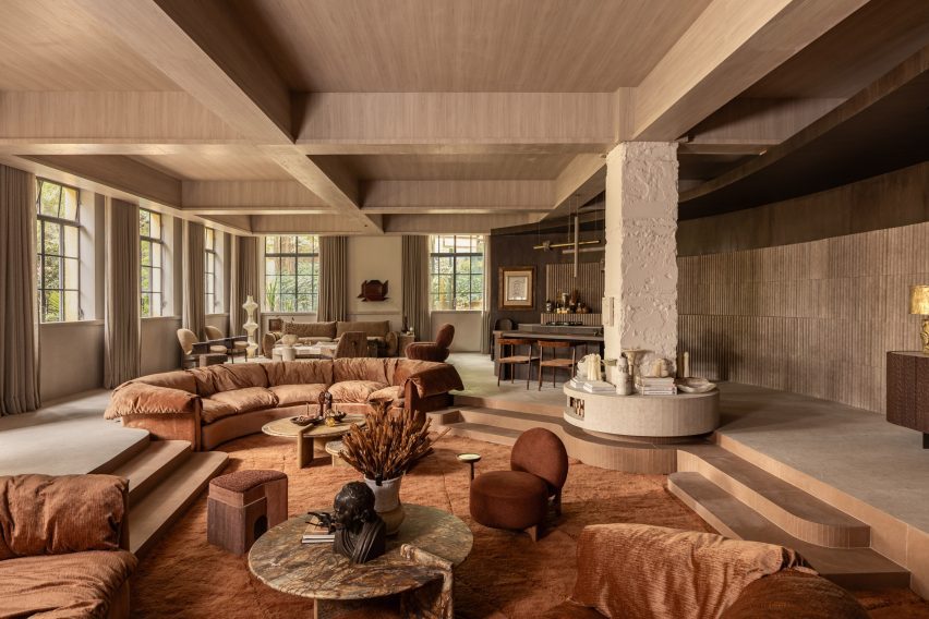 A "living space" featuring warm tones and a sunken lounge