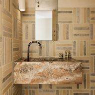 Marbled bathroom in Cinderella House by YSG Studio in Redfern Sydney
