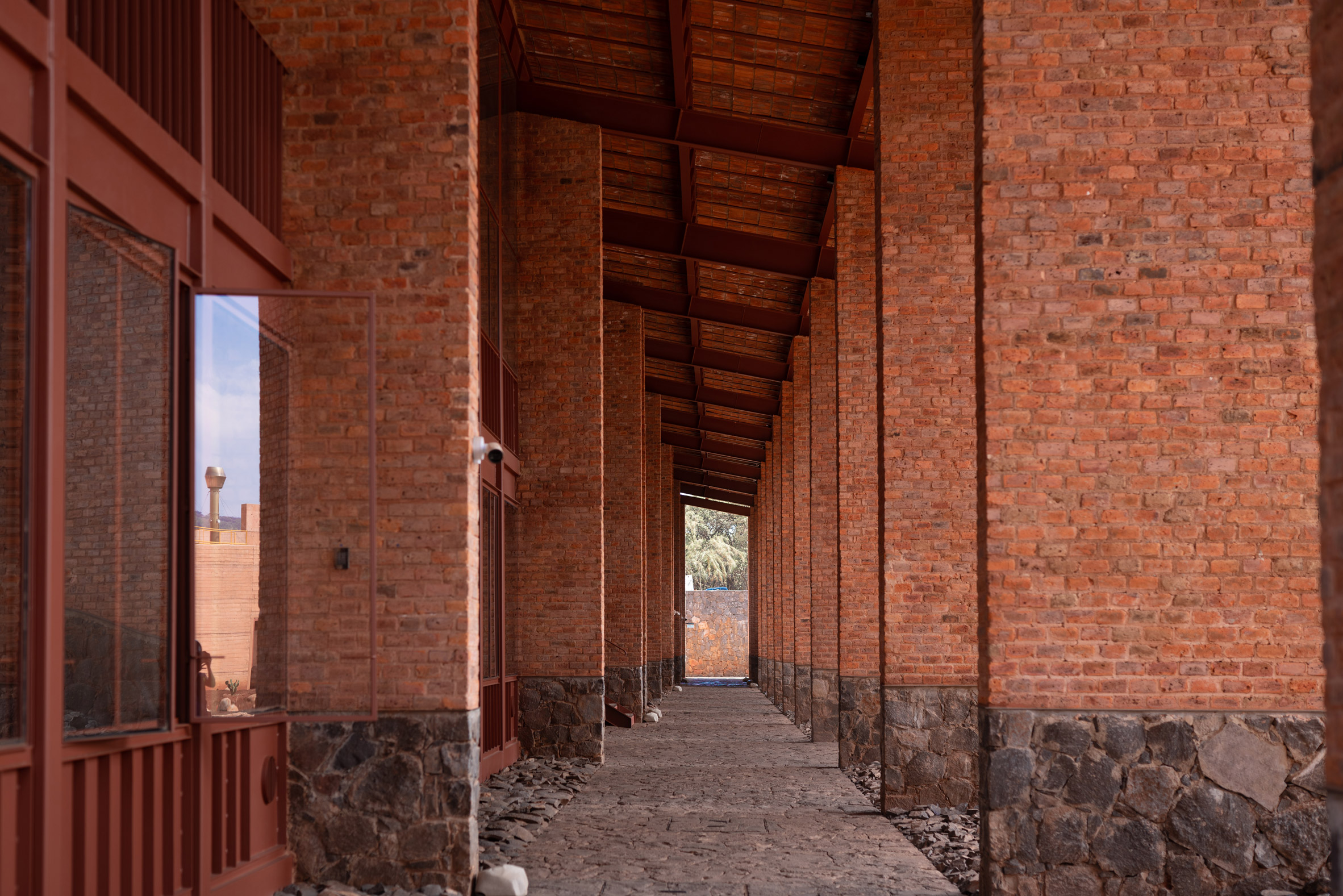 Brick and red-hued metals at Clase Azul La Hacienda