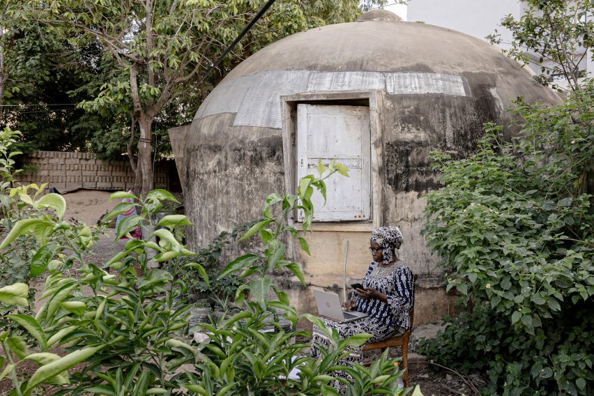 Woman outside house in Senegal