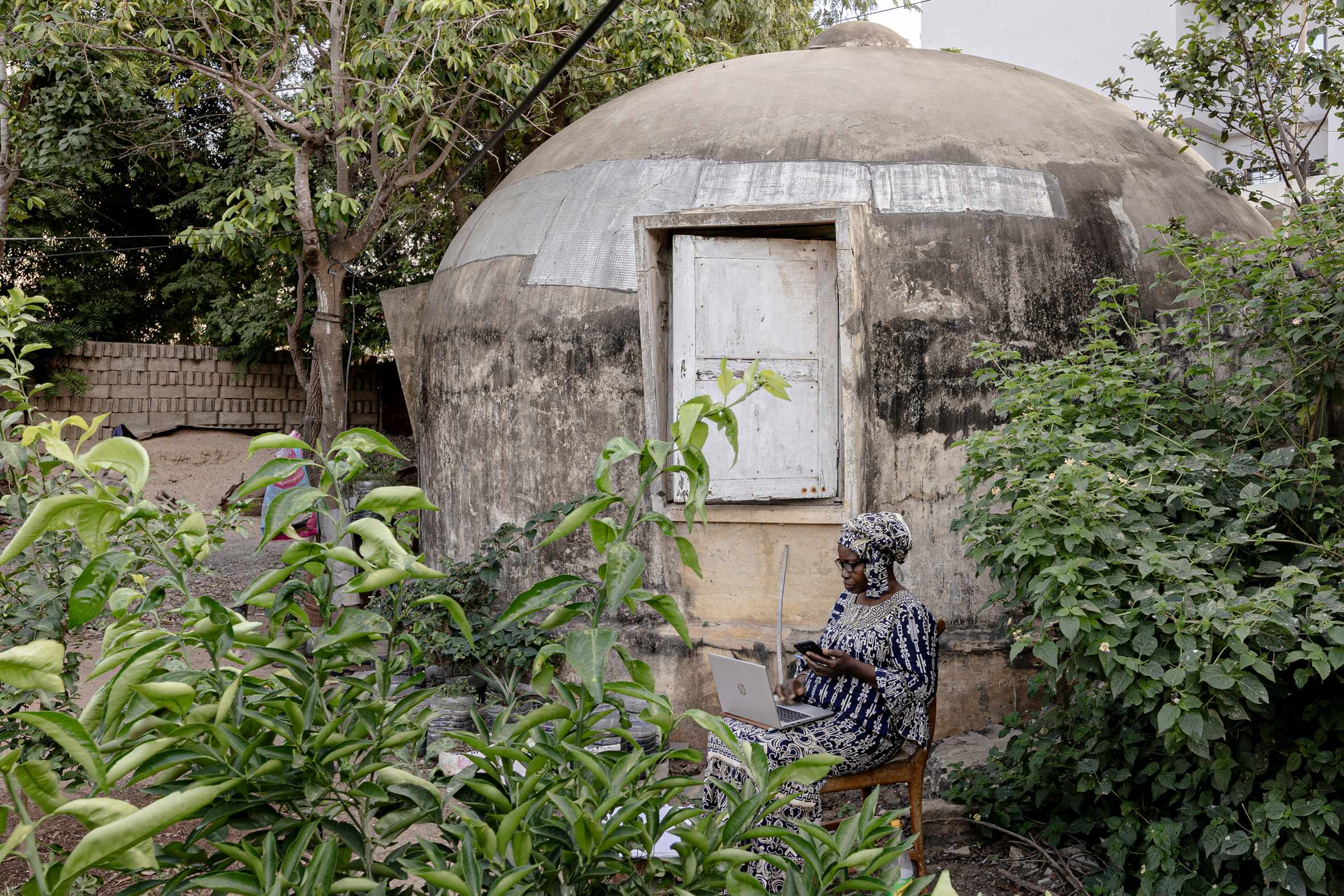 Woman outside house in Senegal