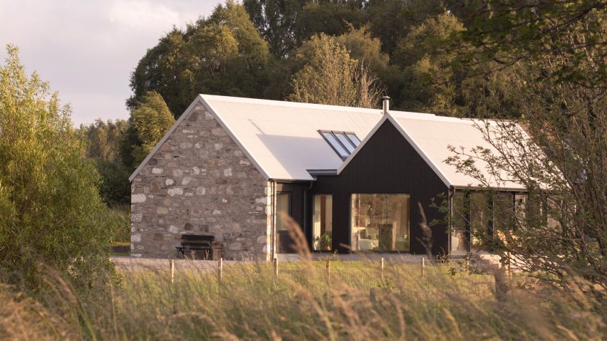 Exterior of Dulnain showing the restored granite cottage beside a blackened-larch extension