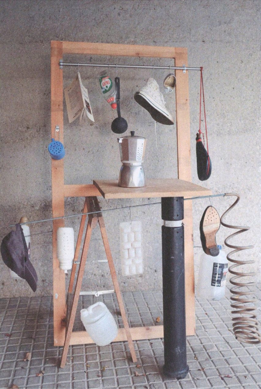 Sculptural structure with household items attached to it