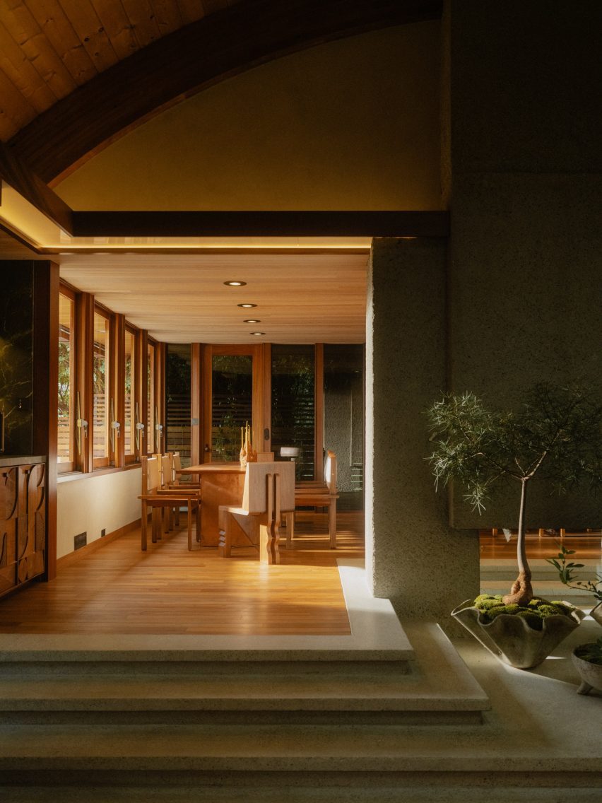 Interior of a renovation 1970s with a dining area raised up three steps
