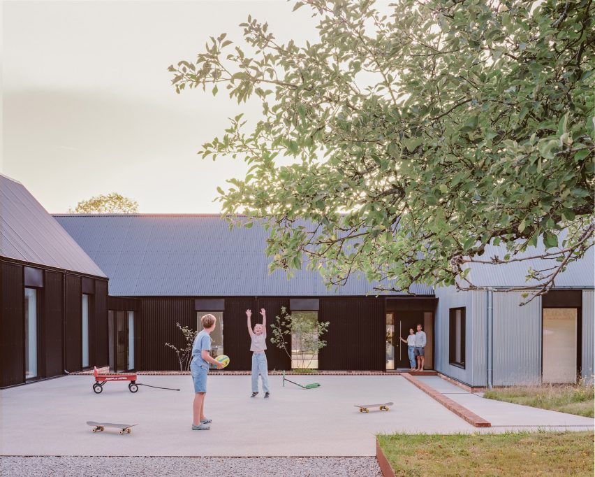 Children playing outside House in a Clearing