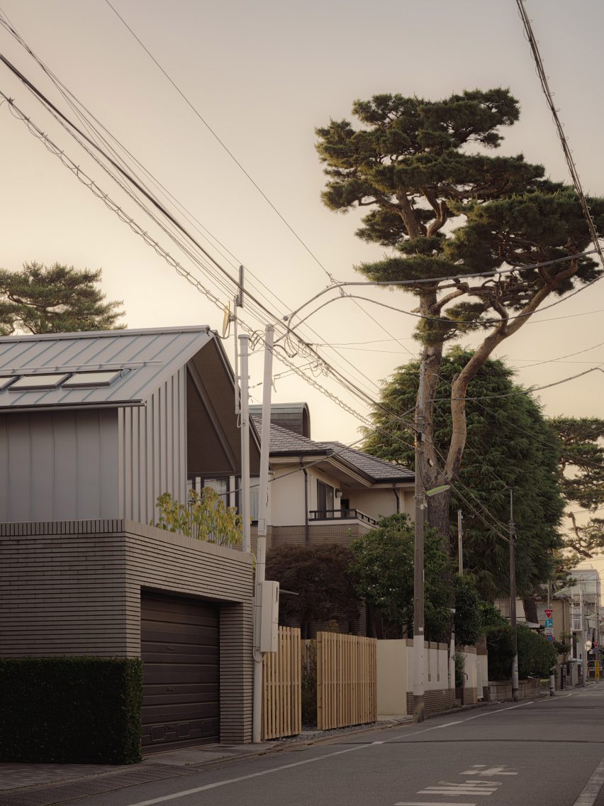 Steel-clad house with tree outside