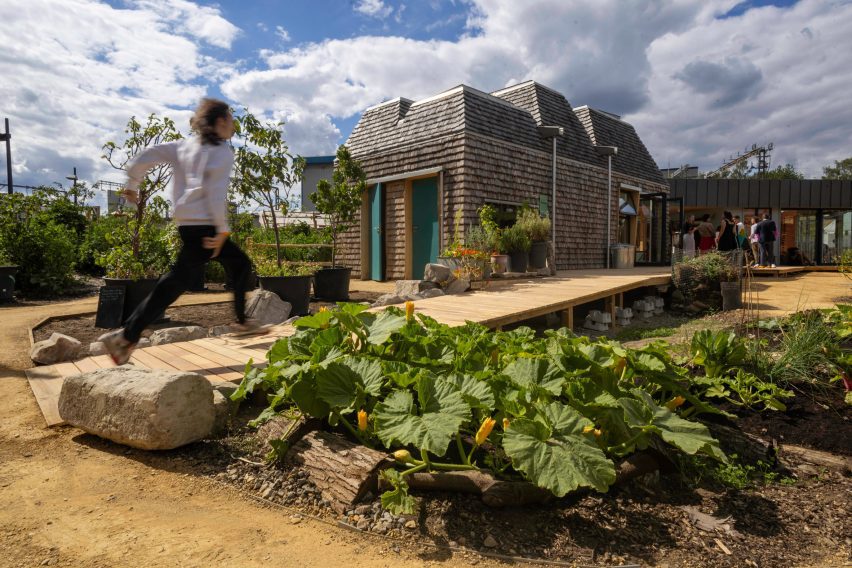 Person walking through new community garden by Jan Kattein Architects