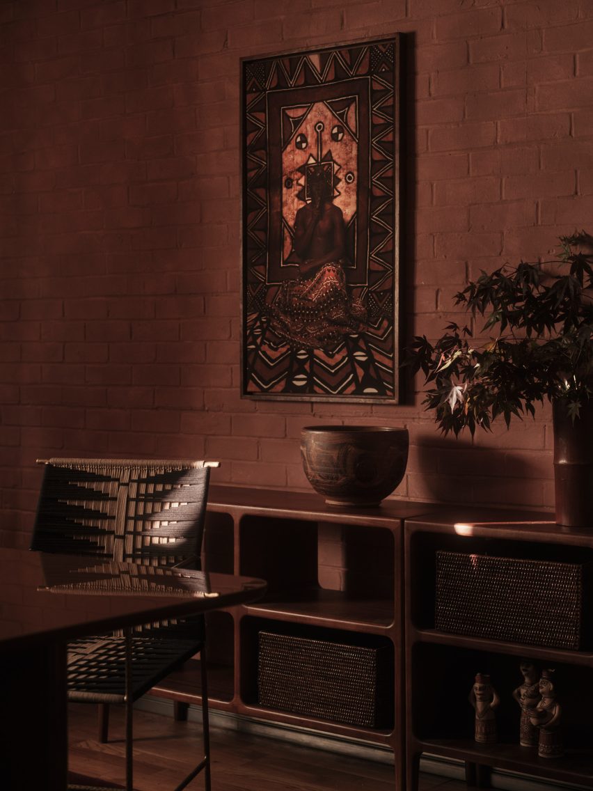 Close-up of wooden sideboard and chairs