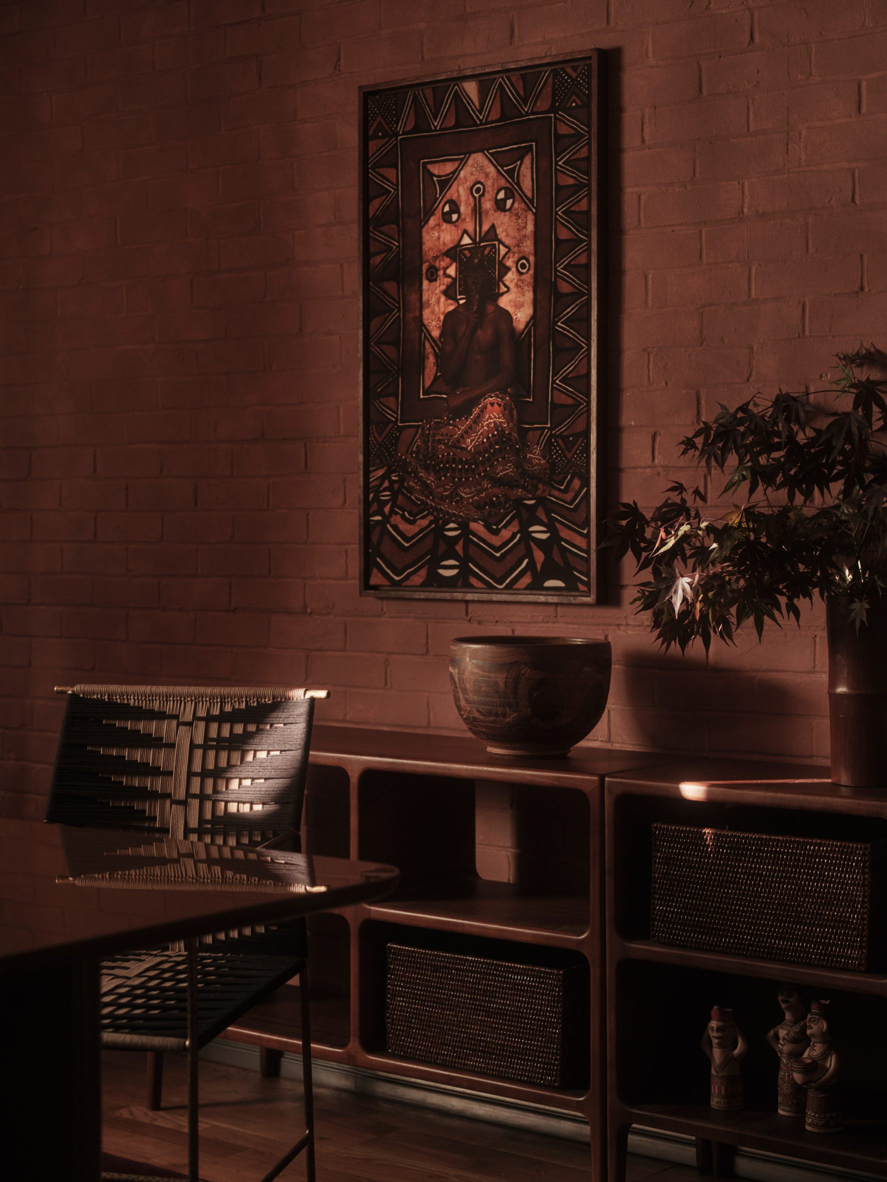 Close-up of wooden sideboard and chairs