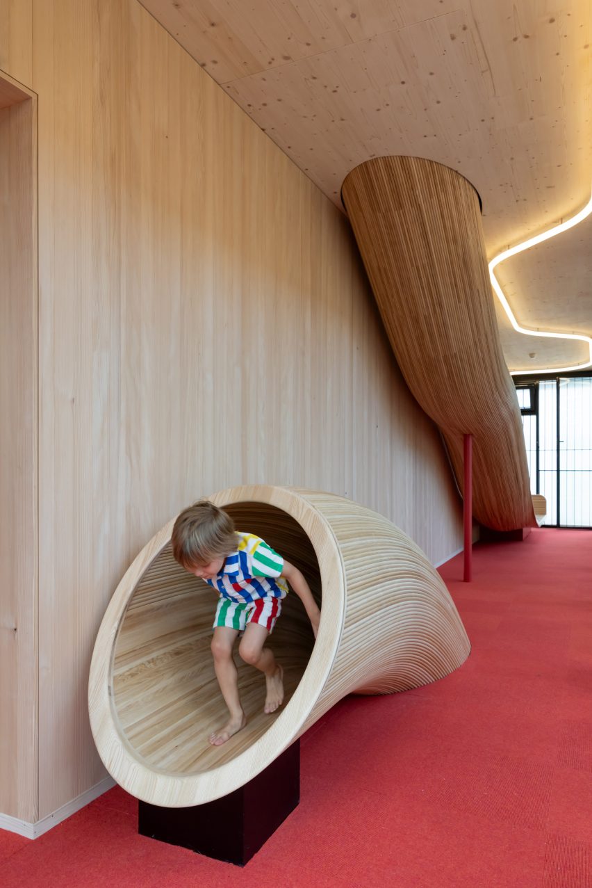 Child using slide at TUM kindergarten