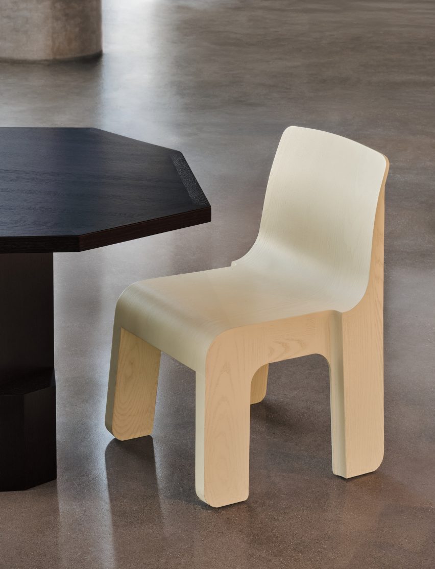 Yellow wooden chair with a black table