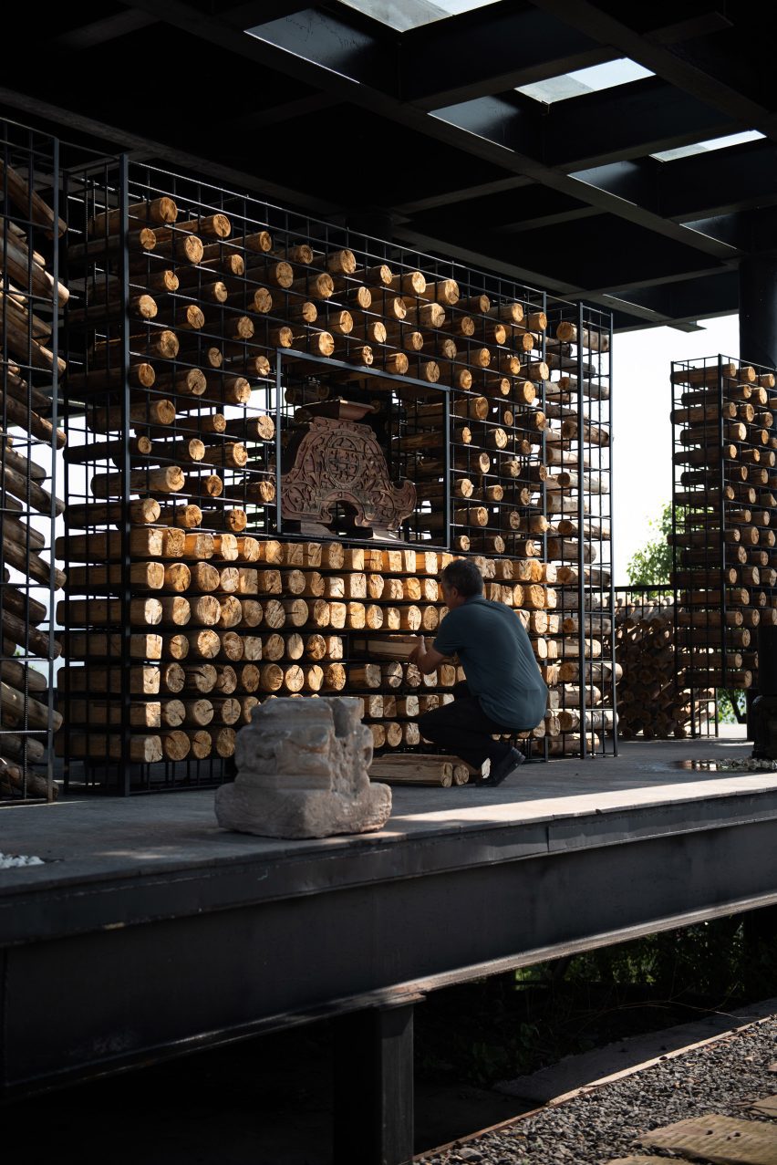 Person placing a cedar log at shelter in China