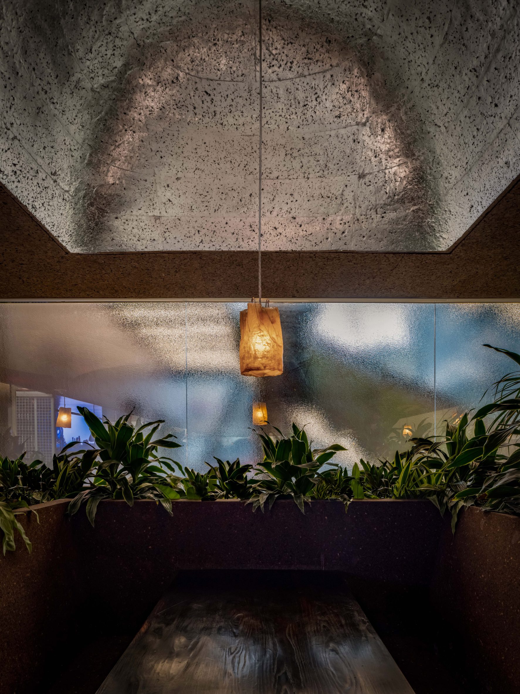 Booth seating and ceilings made entirely from black expanded cork