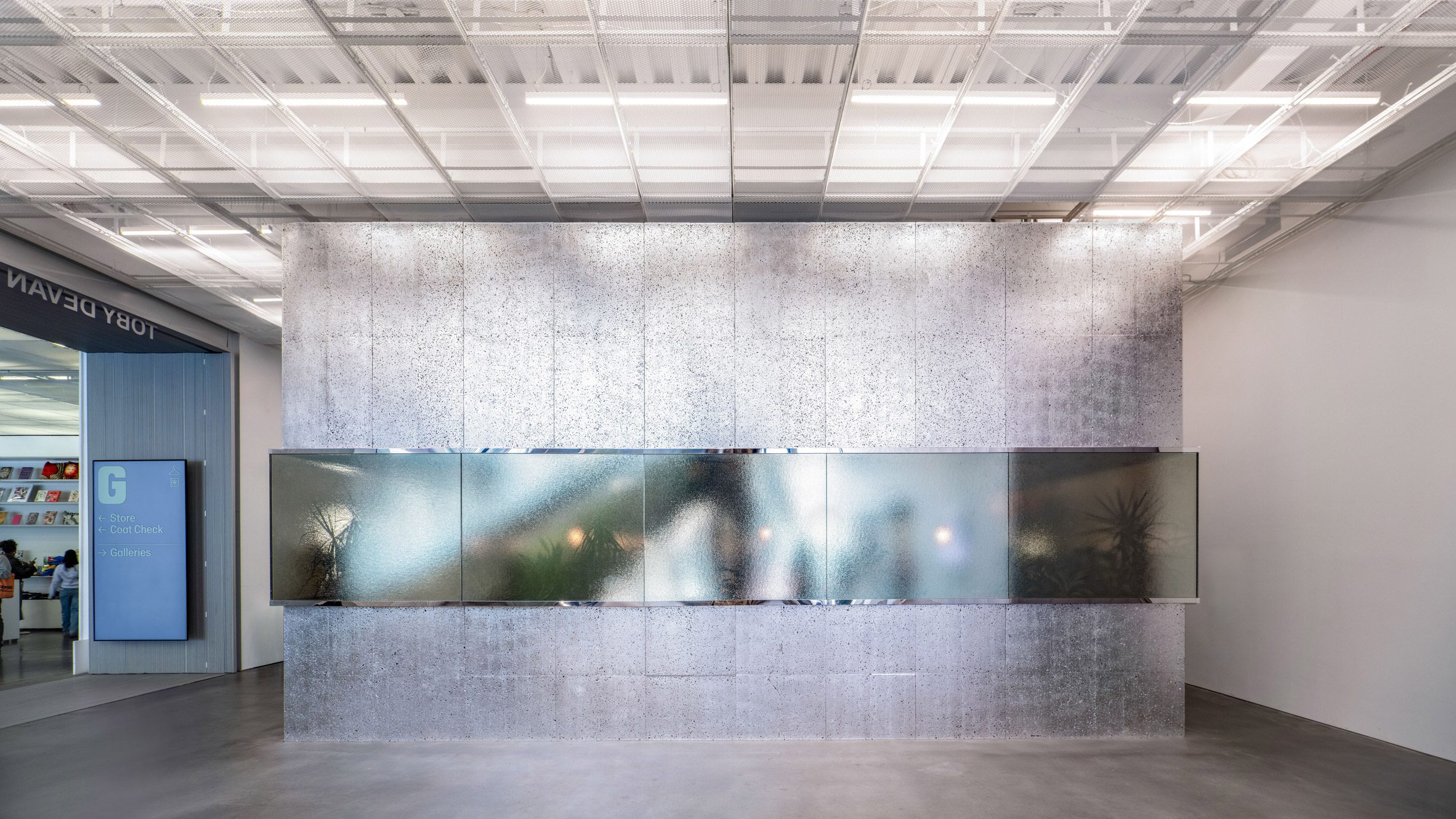 A metallic box within the ground-floor lobby of the expanded New Museum