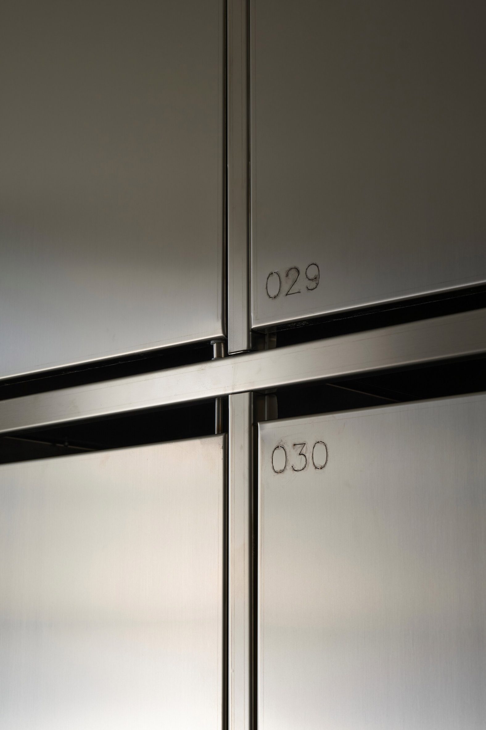 Numbers etched onto locker fronts