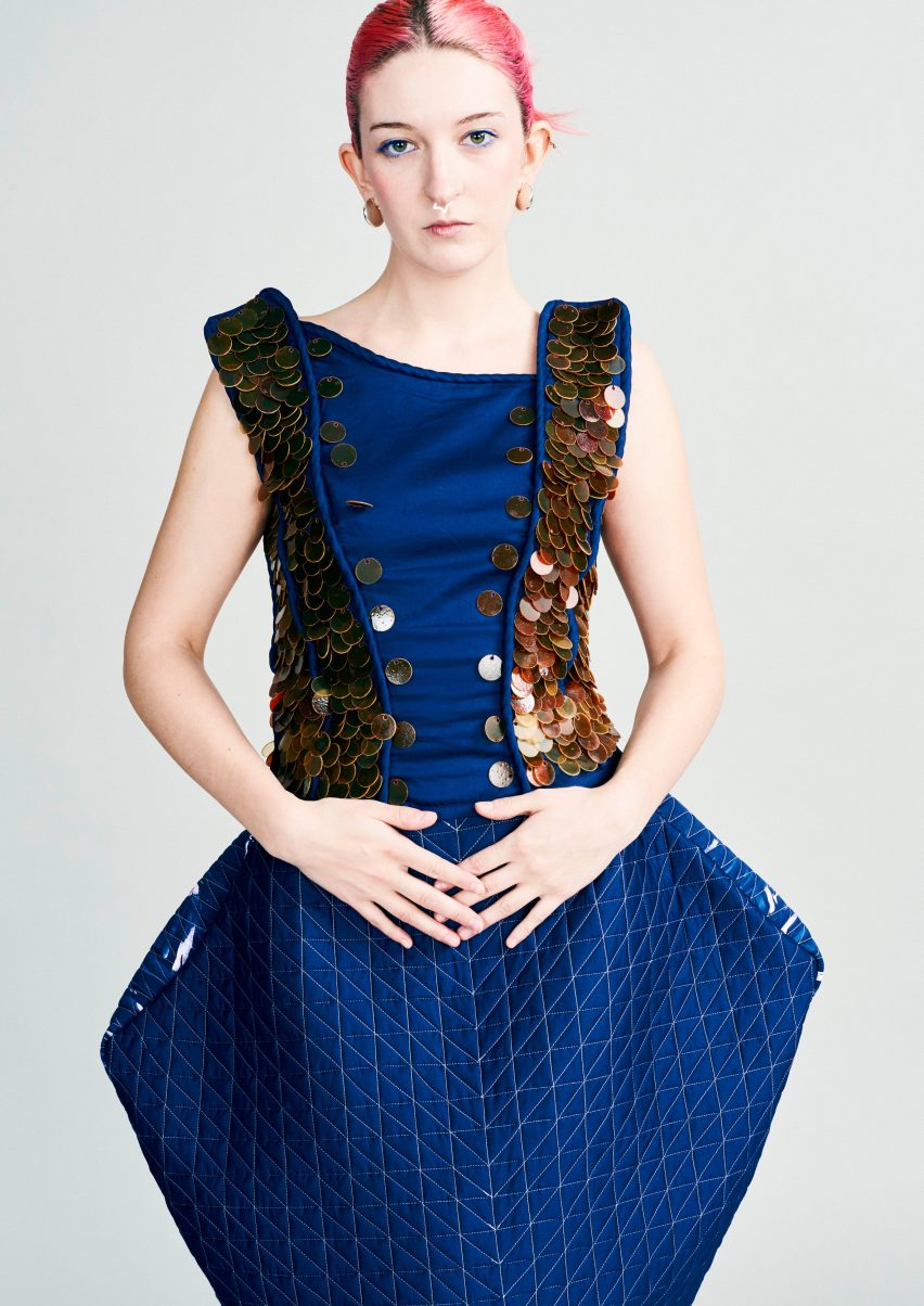 Model wearing structured blue garment