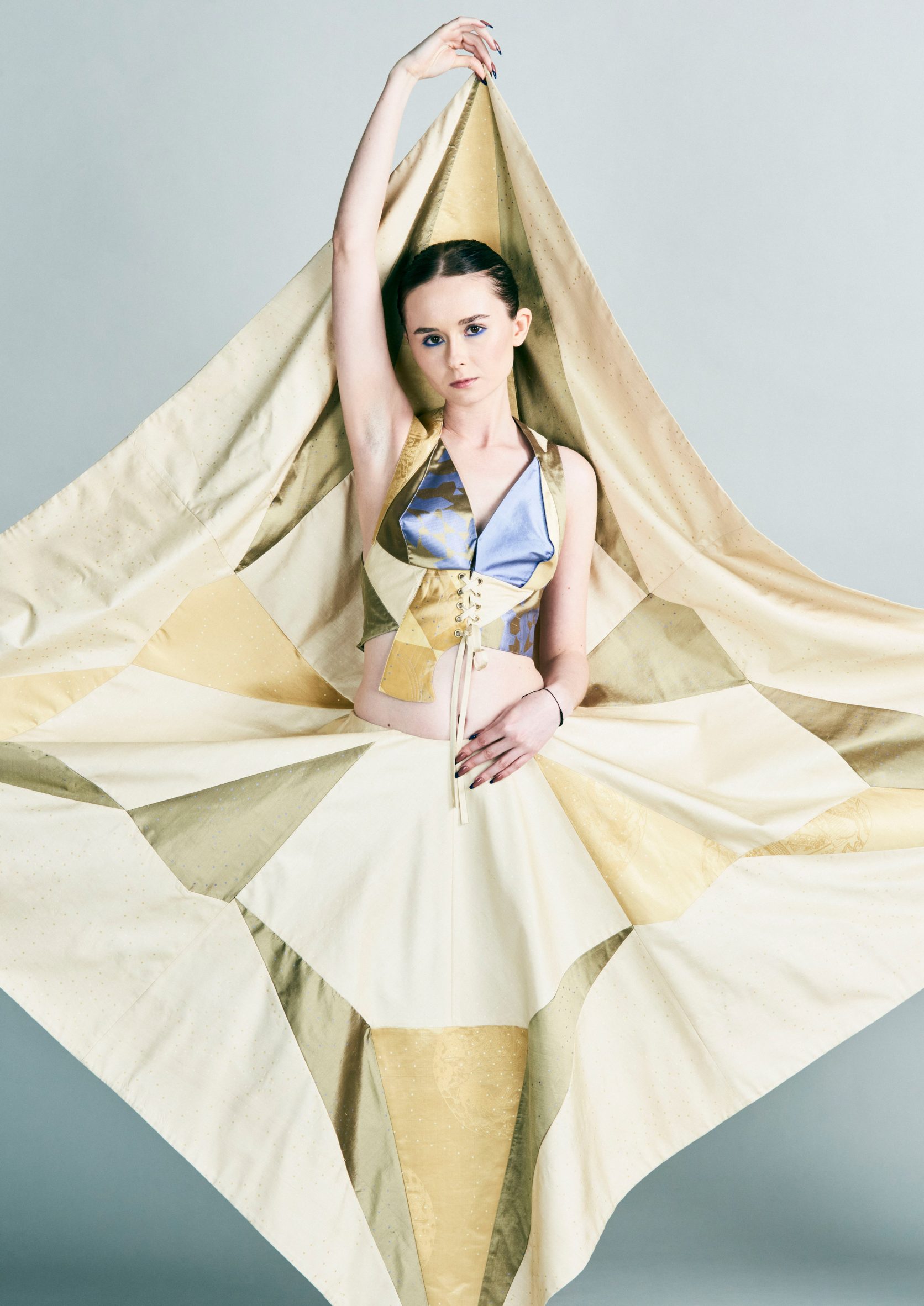 Model wearing diamond-shaped garment