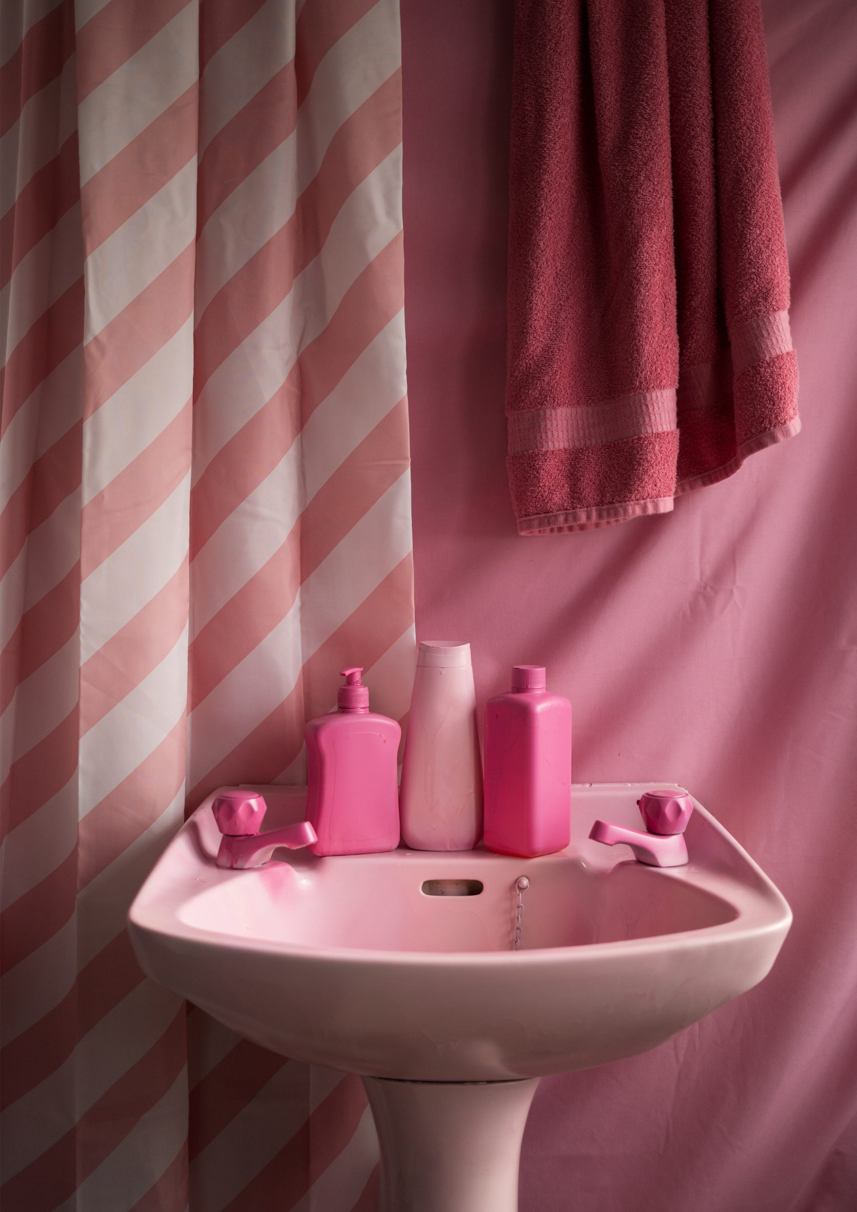 View of a bathroom sink where everything is rendered in pink