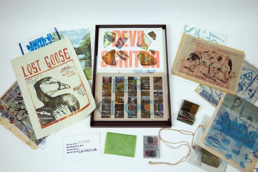 Presentation box on table containing illustrated sheets of paper