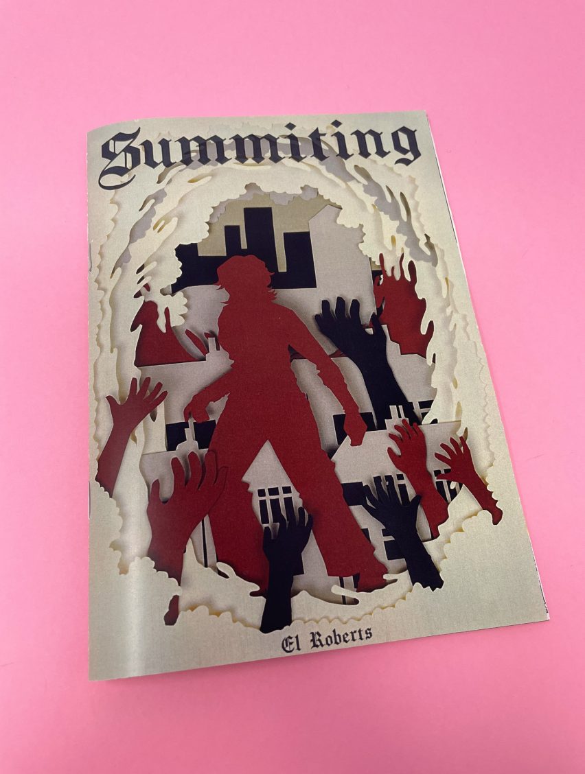 Zine with a red figure surrounded by hands on the cover