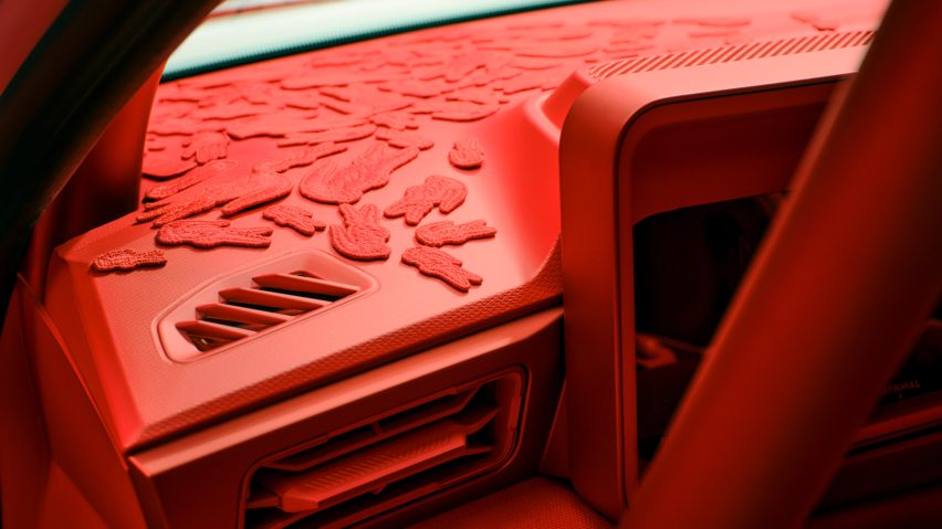 Lacoste crocodile patch on dashboard of car