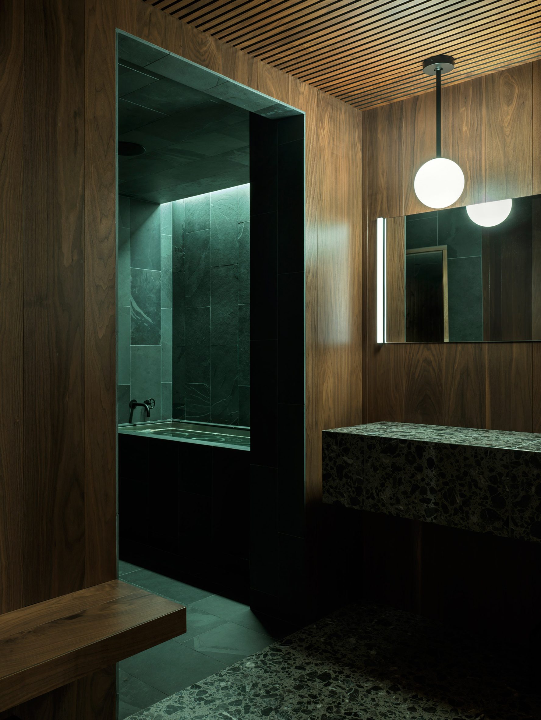 A walnut-lined changing area and slate cold plunge