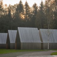 Black timber and copper cloaks Sanctum nature retreat in Lithuanian woodland