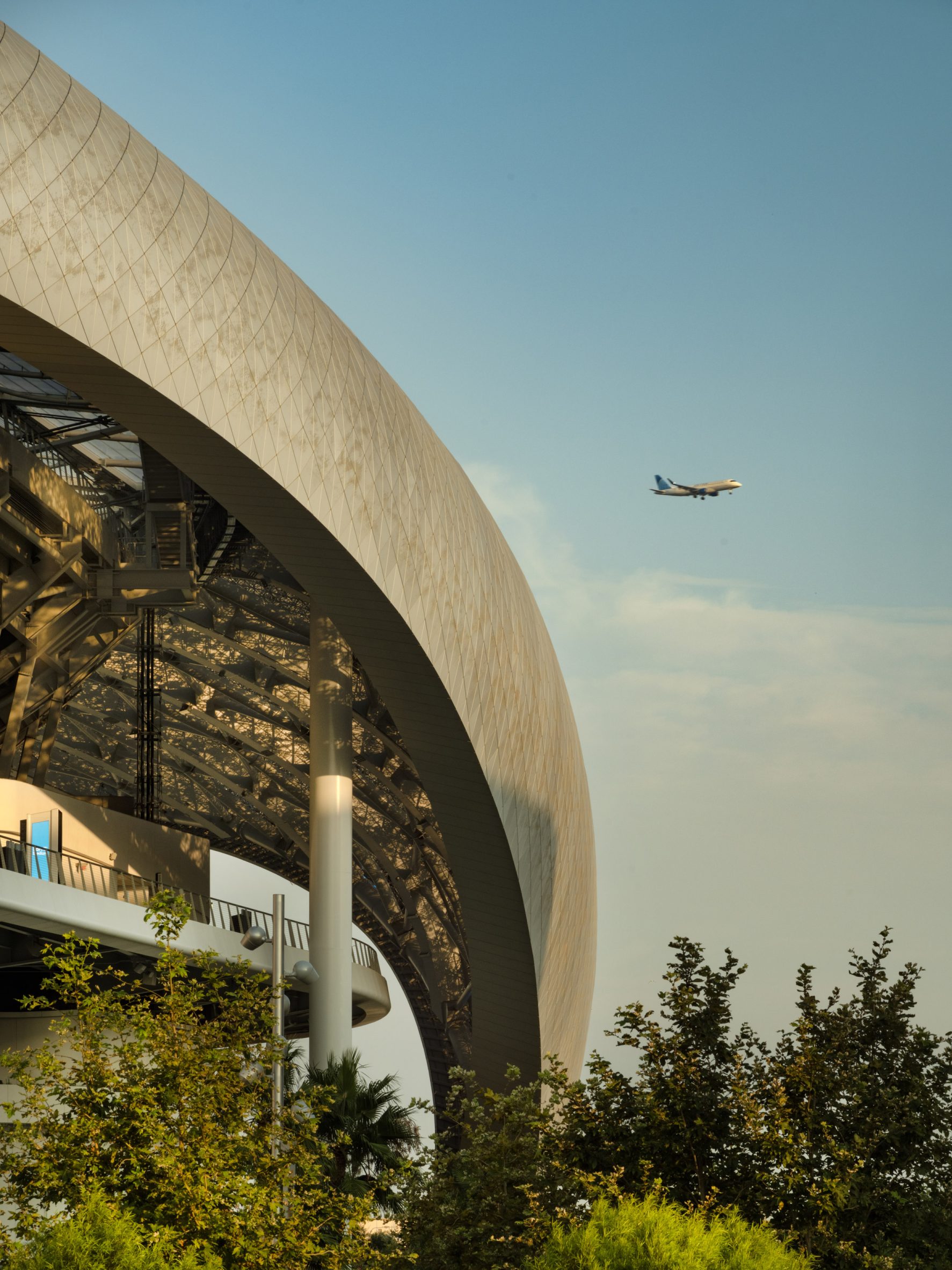 SoFi stadium with an airplane